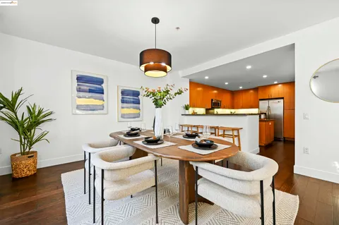 a kitchen with a table and chairs