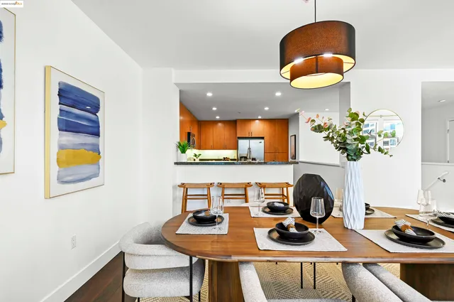 a dining room with furniture and wooden floor
