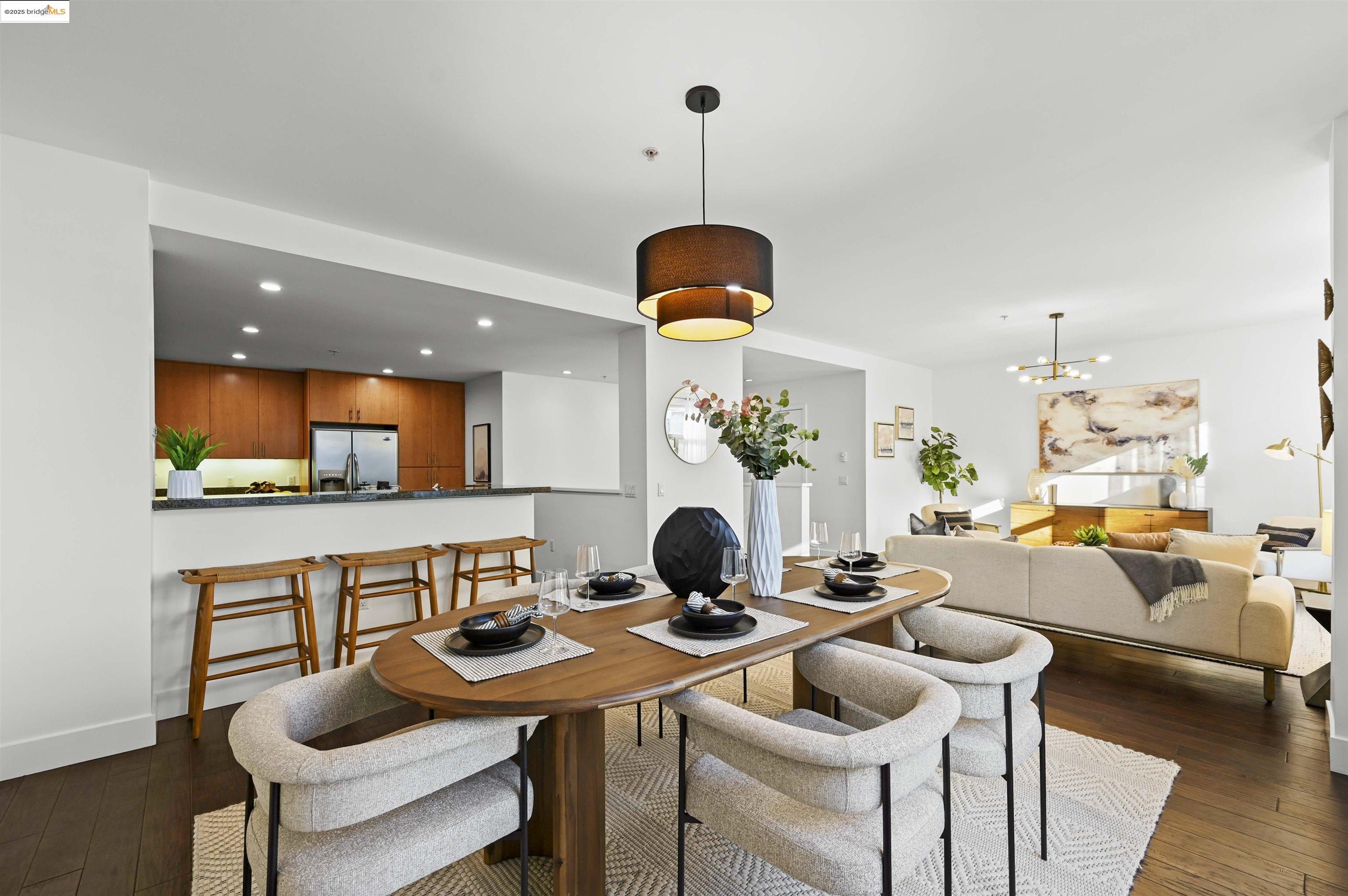 438 West Grand Avenue, Unit 422 Oakland, CA 94612 - Photo 16 of 52 Dining room with dark wood-type flooring, recessed lighting, and a chandelier