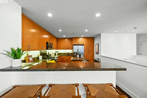 a kitchen with a sink and a large window