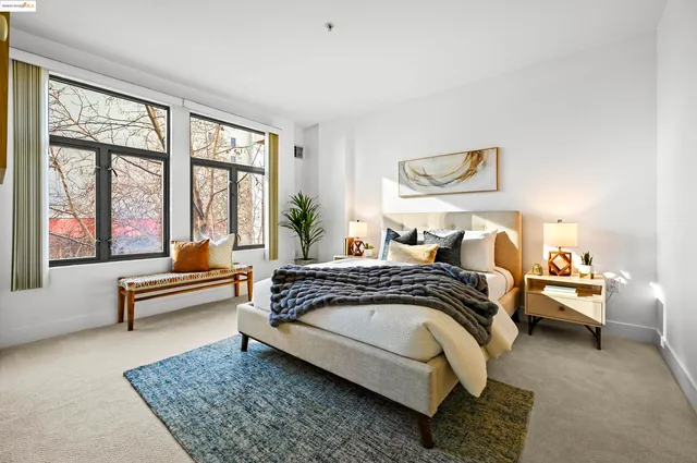 a bedroom with a bed and glass window