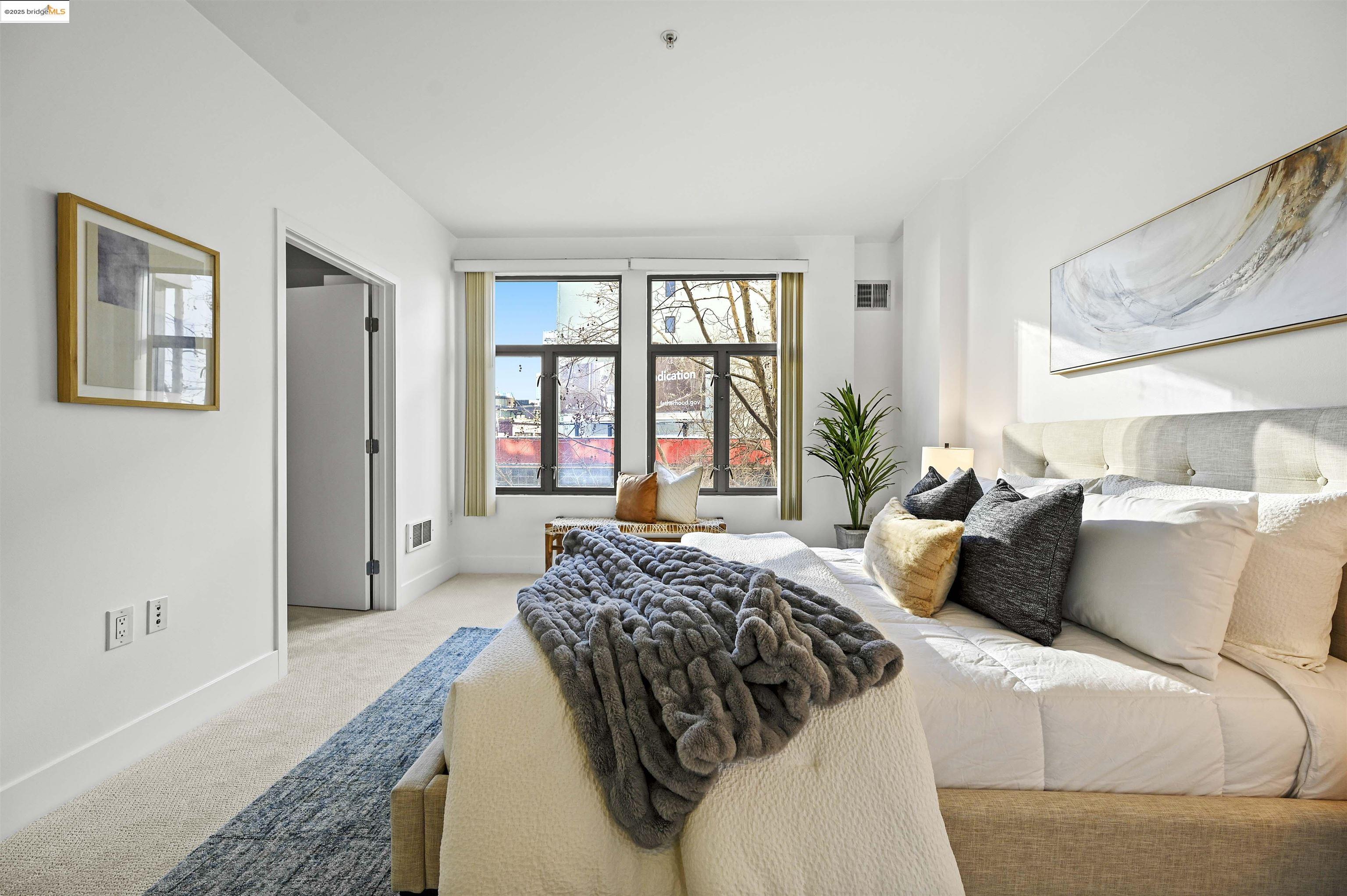 438 West Grand Avenue, Unit 422 Oakland, CA 94612 - Photo 25 of 52 Bedroom with carpet and baseboards