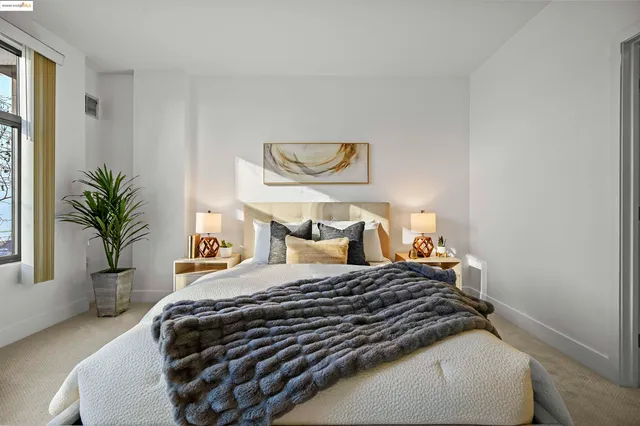 a bedroom with a bed and window