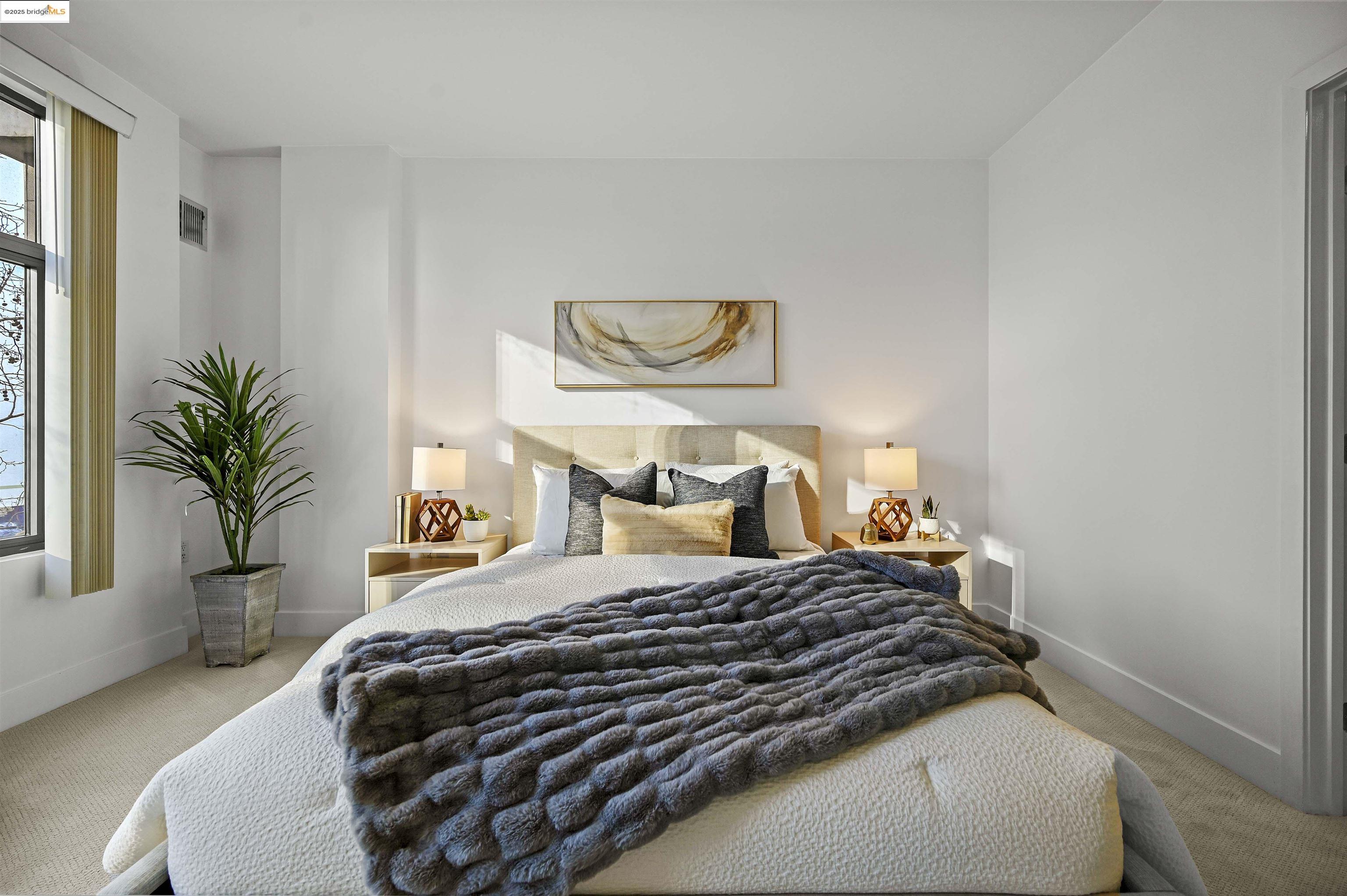 438 West Grand Avenue, Unit 422 Oakland, CA 94612 - Photo 27 of 52 Carpeted bedroom featuring baseboards