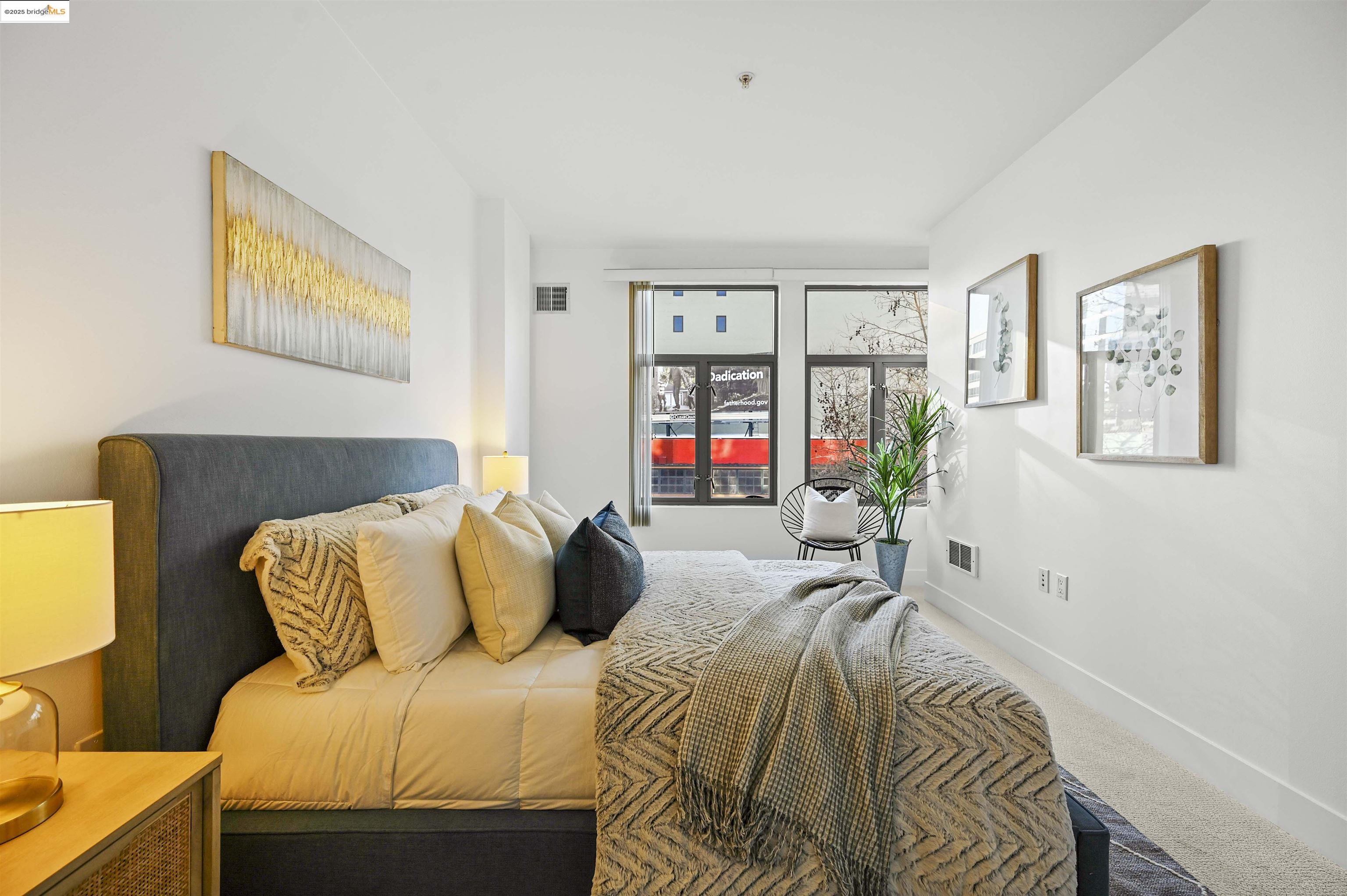 438 West Grand Avenue, Unit 422 Oakland, CA 94612 - Photo 34 of 52 Bedroom featuring baseboards and carpet flooring