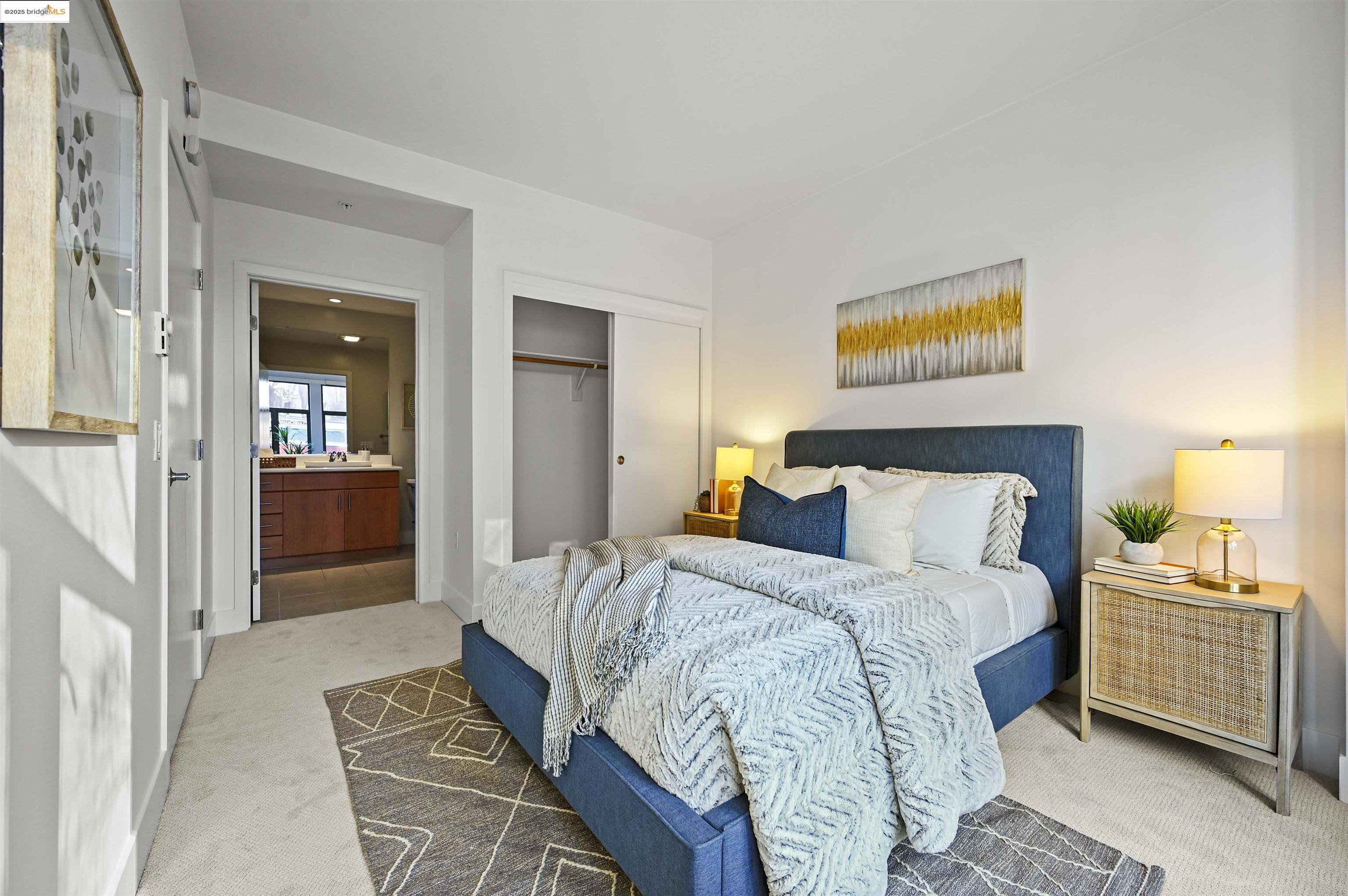 438 West Grand Avenue, Unit 422 Oakland, CA 94612 - Photo 37 of 52 Carpeted bedroom with a closet