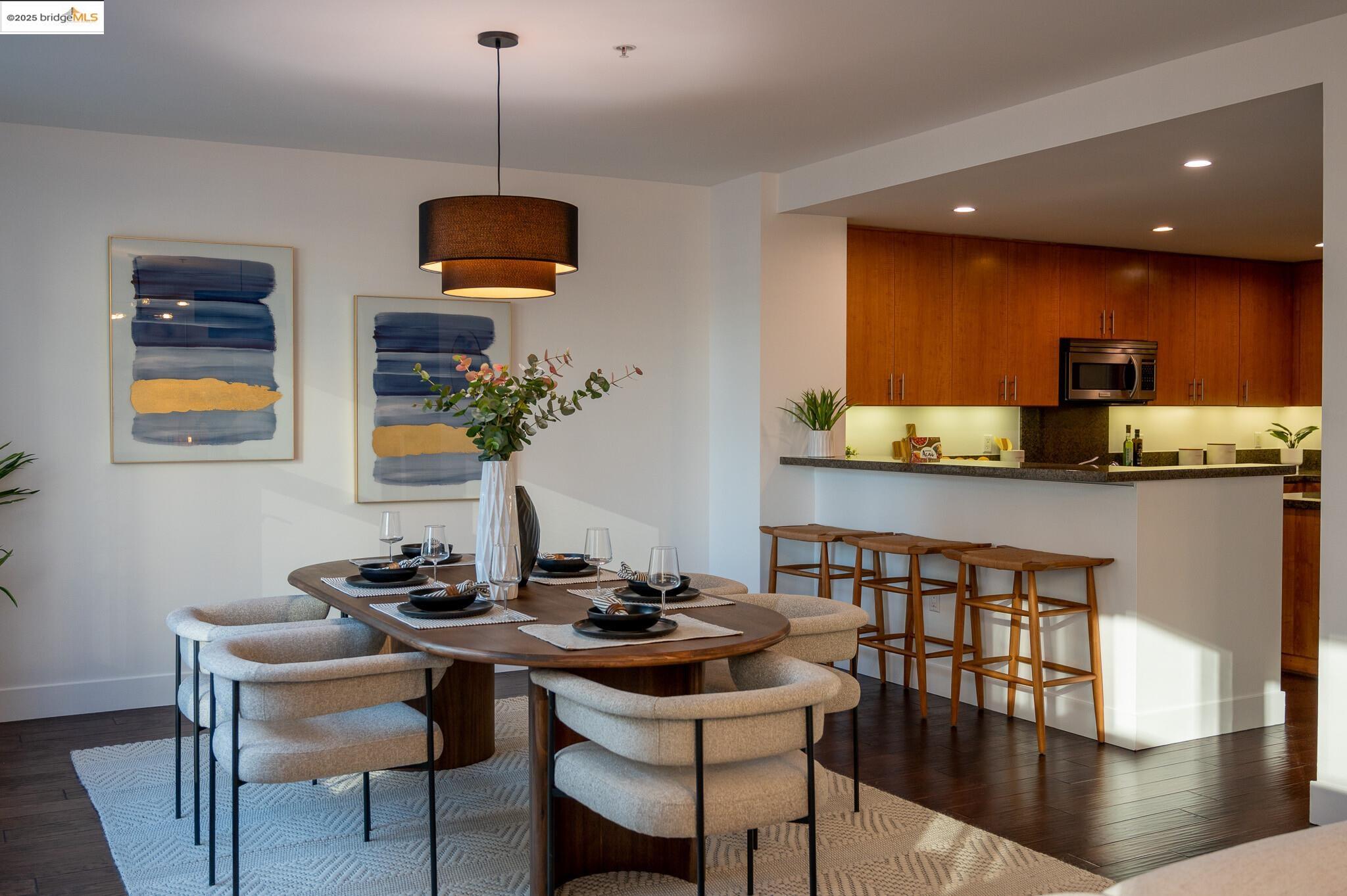 438 West Grand Avenue, Unit 422 Oakland, CA 94612 - Photo 41 of 52 Dining room with recessed lighting and dark wood finished floors