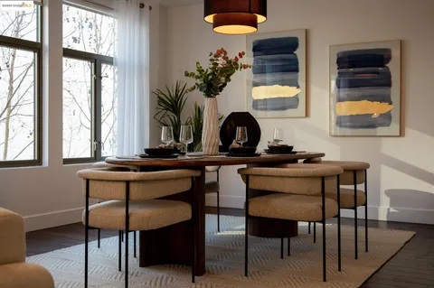 a view of a workspace with furniture and a potted plant