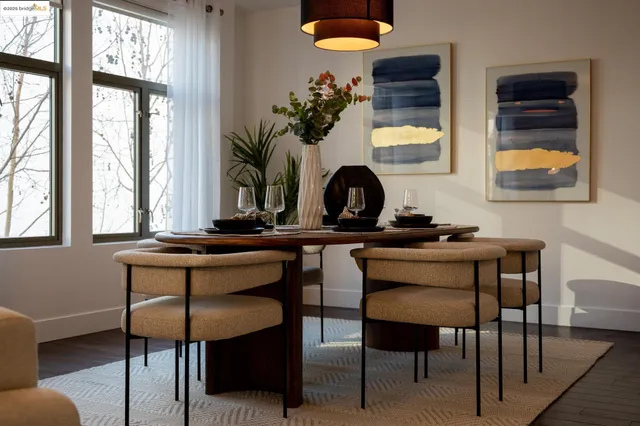 a view of a workspace with furniture and a potted plant