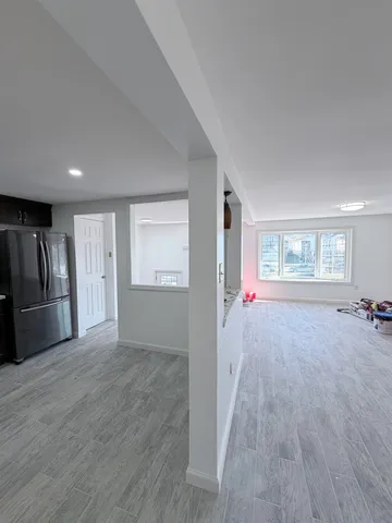 a view of an empty room with a window