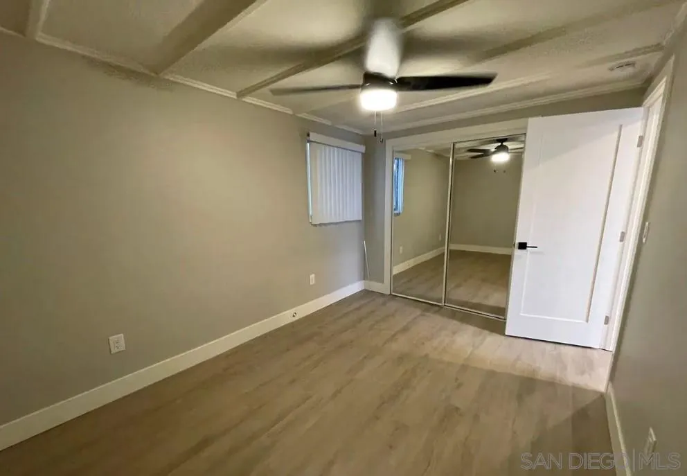 2136 Reed Avenue San Diego, CA 92109 - Photo 22 of 41 an empty room with wooden floor