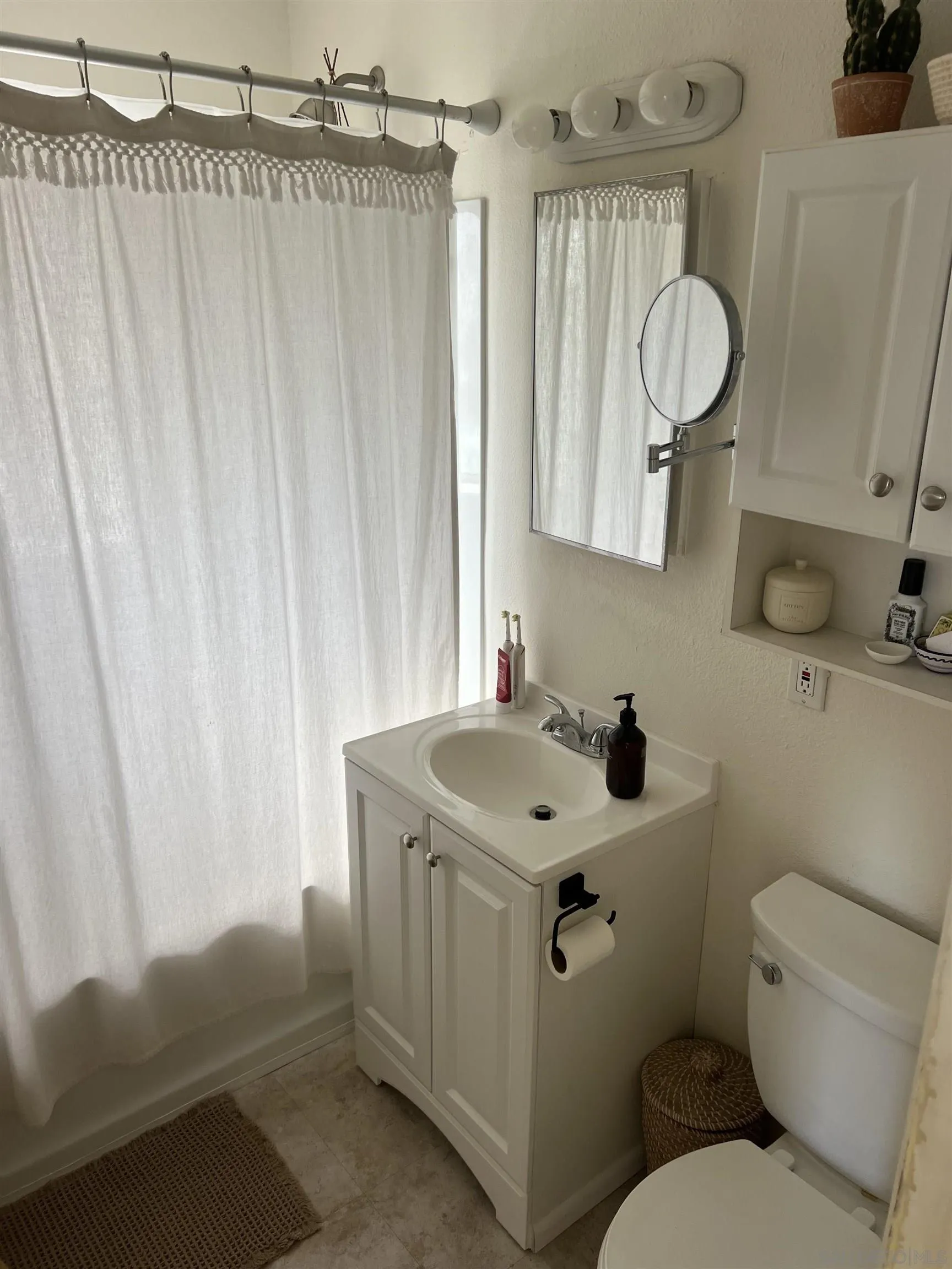 2136 Reed Avenue San Diego, CA 92109 - Photo 37 of 41 a bathroom with a sink toilet and shower