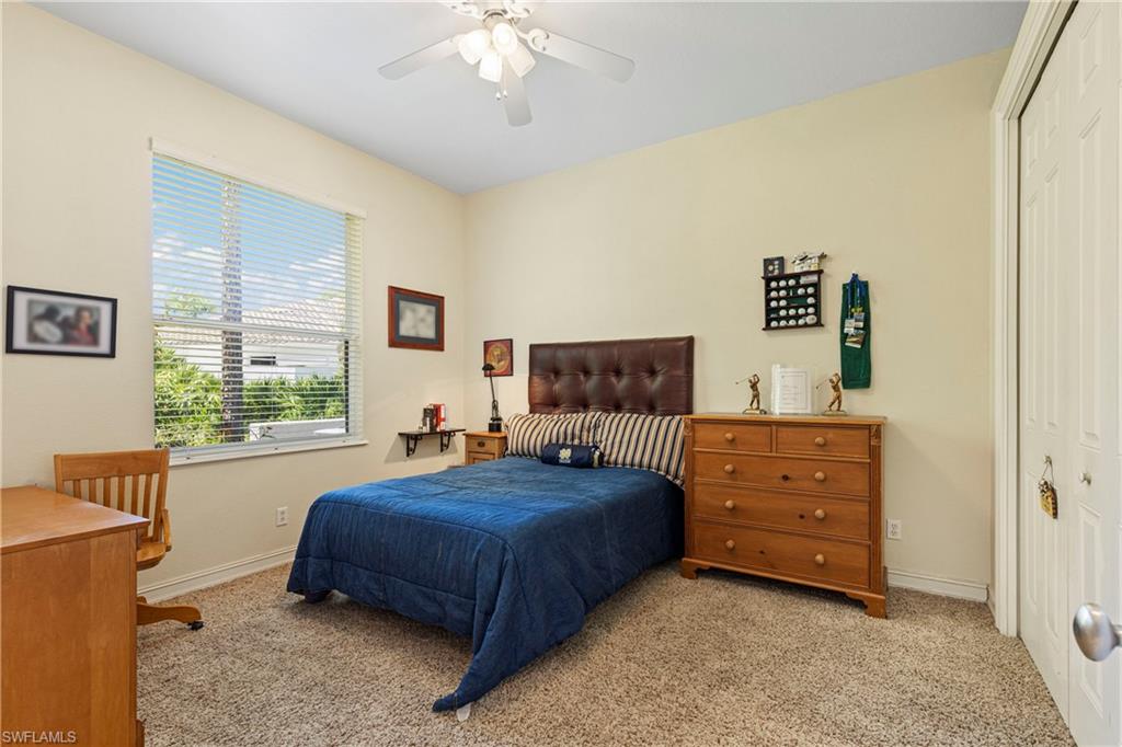 2116 Harlans Run Naples, FL 34105 - Photo 20 of 35 Bedroom with carpet, a closet, and ceiling fan