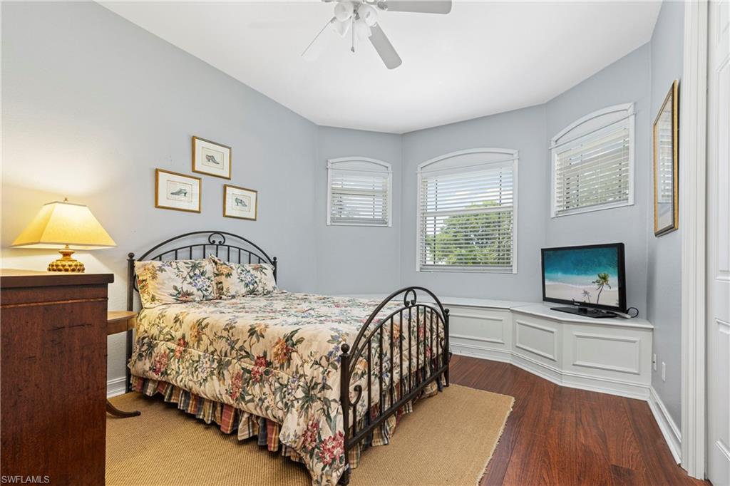 2116 Harlans Run Naples, FL 34105 - Photo 25 of 35 Bedroom with wood finished floors and a ceiling fan