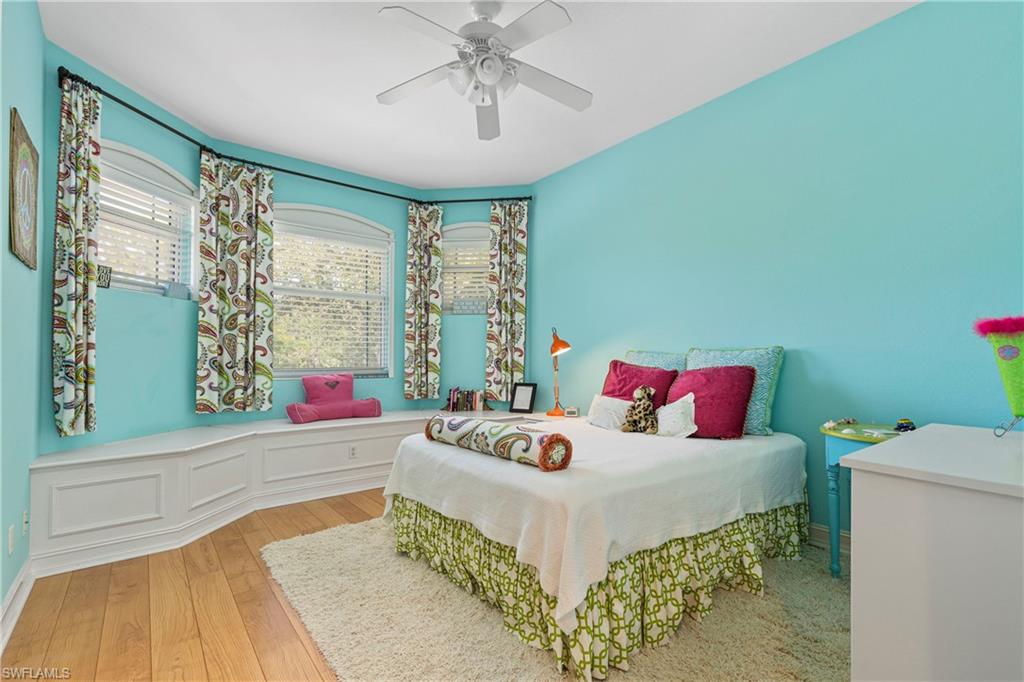 2116 Harlans Run Naples, FL 34105 - Photo 27 of 35 Bedroom with hardwood / wood-style flooring and ceiling fan