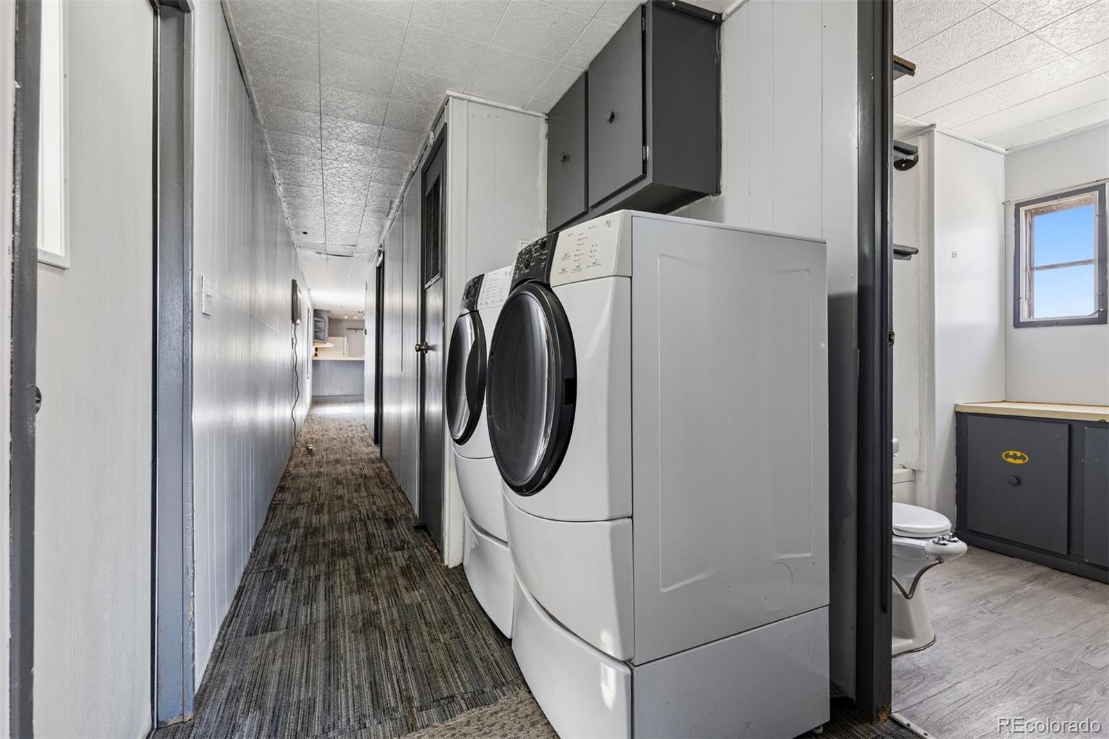 1044 Mac Davidson Circle Dacono, CO 80514 - Photo 13 of 25 a utility room with dryer and washer