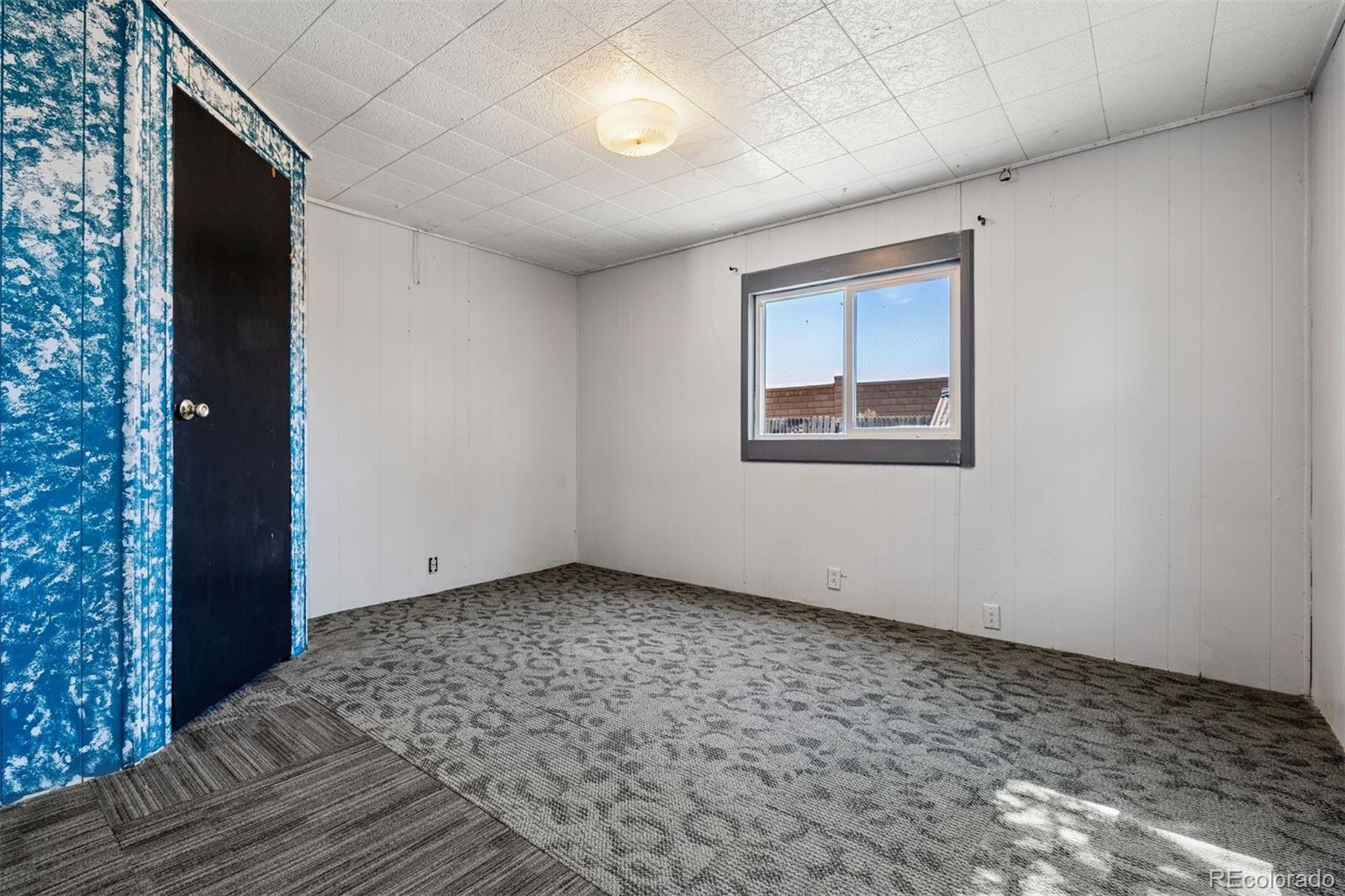 1044 Mac Davidson Circle Dacono, CO 80514 - Photo 15 of 25 a view of an empty room with a window