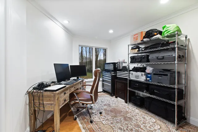 a view of a workspace with furniture