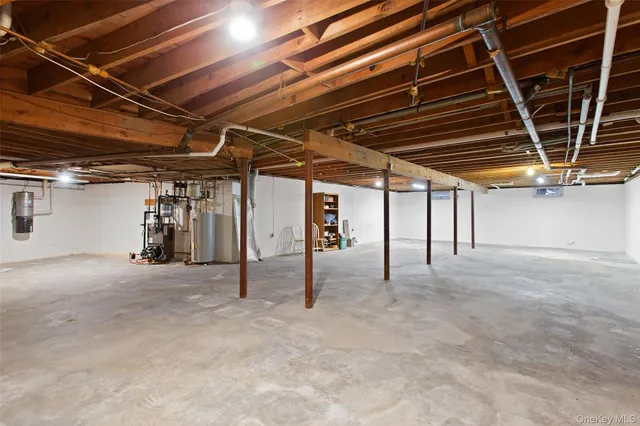 a view of empty room with wooden ceiling