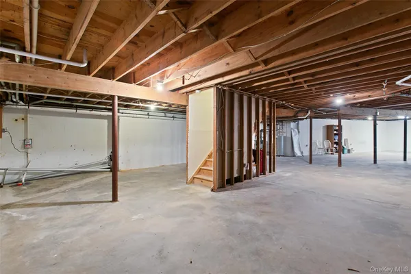 a view of an empty room with wooden walls