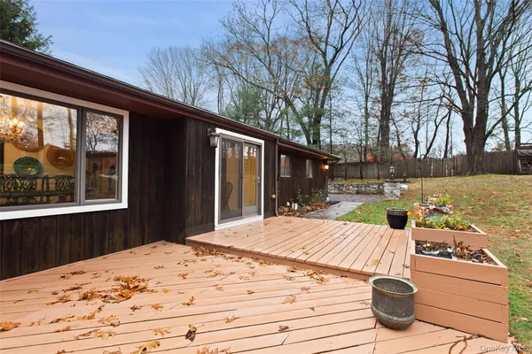 a view of a backyard with sitting area
