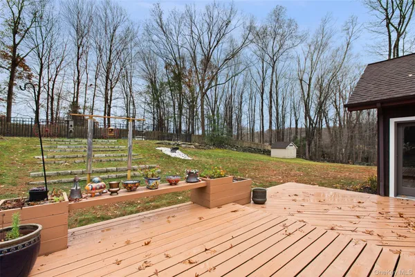 a view of a backyard with swimming pool