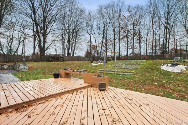 a view of a lake with couches and wooden floor