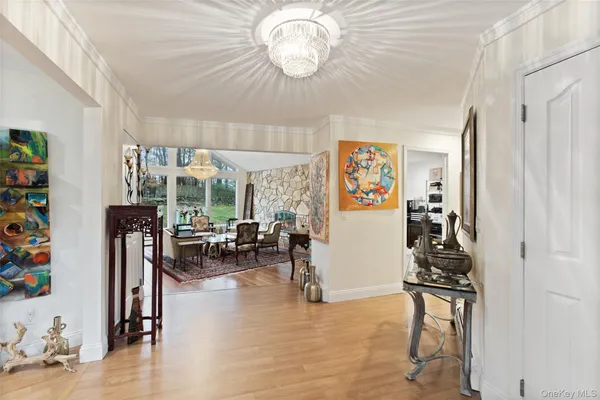 a view of a livingroom with furniture and a window