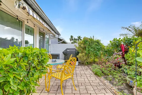 a view of a house with garden and plants