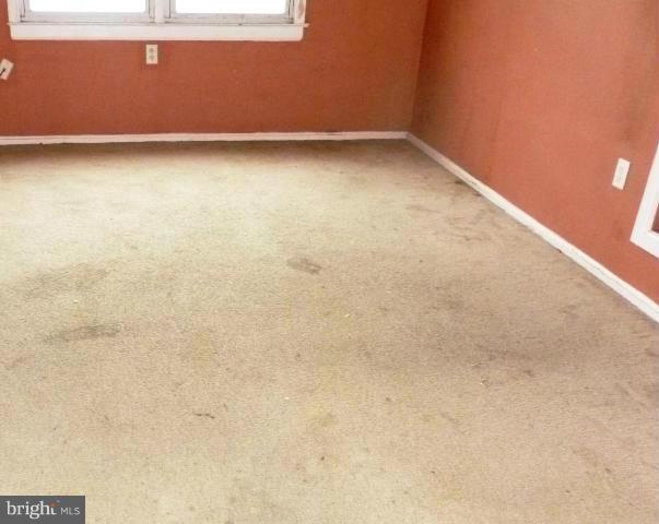726 Templecliff Road Pikesville, MD 21208 - Photo 4 of 8 a view of a room with wooden floor