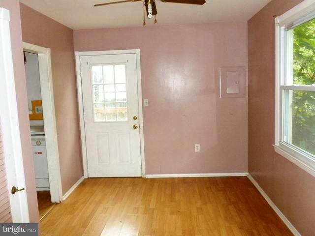 726 Templecliff Road Pikesville, MD 21208 - Photo 6 of 8 an empty room with windows