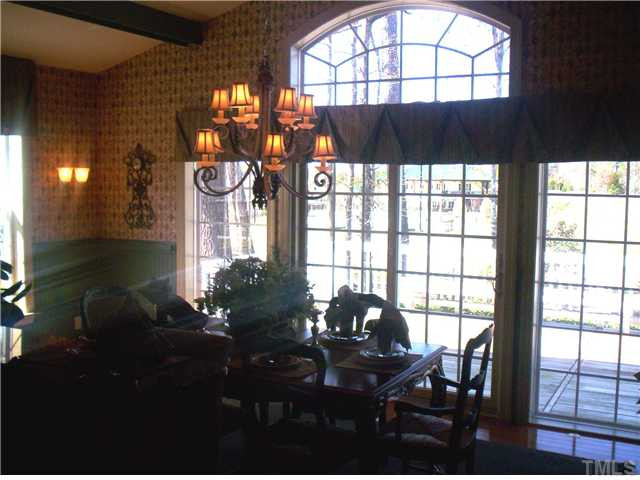 204 Ivyshaw Road Cary, NC 27519 - Photo 8 of 12 Large morning room easily holds a table for 8 - lots of windows in this space.