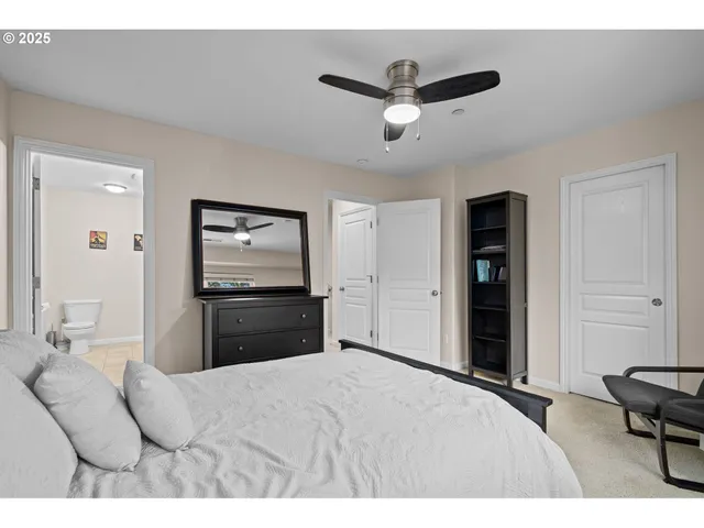 a bedroom with a bed and a television