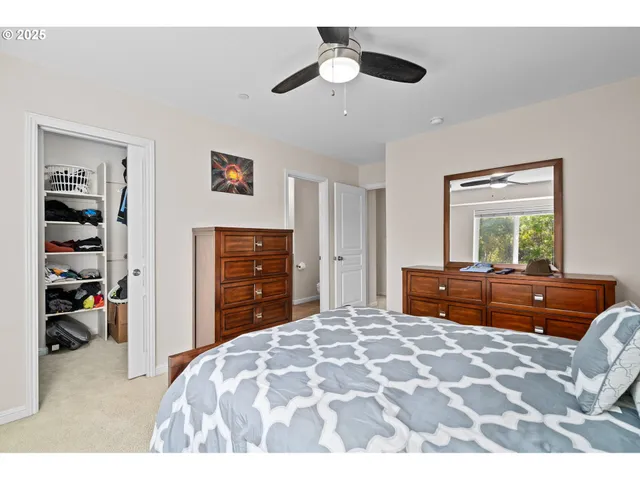 a bed room with a bed and a television