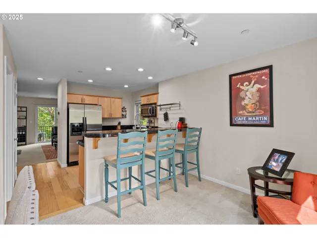 a living room with furniture a kitchen island with furniture