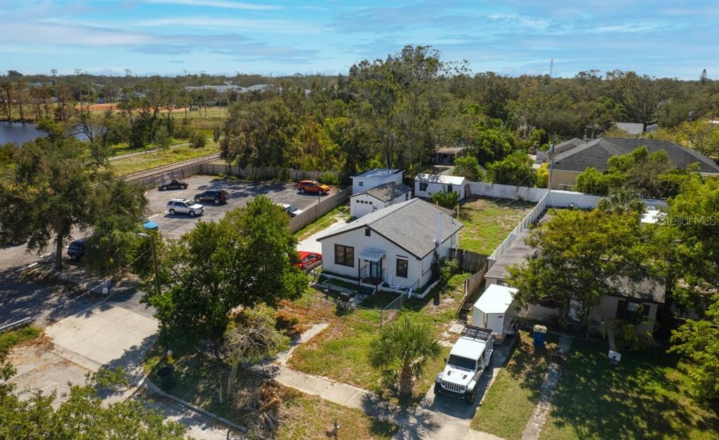 an aerial view of a house with a yard
