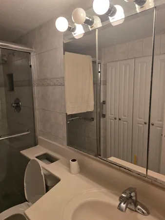 a living room with furniture and large windows