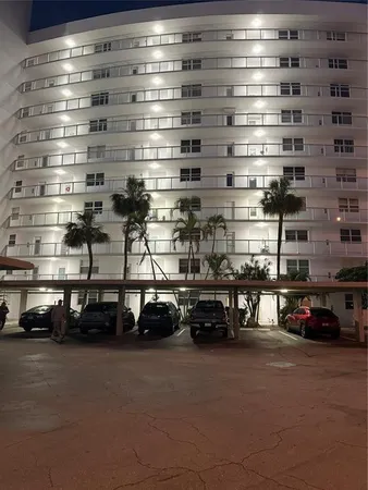 a view of a patio with table and chairs and potted plants