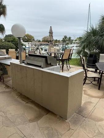 a view of house with a yard and sitting area