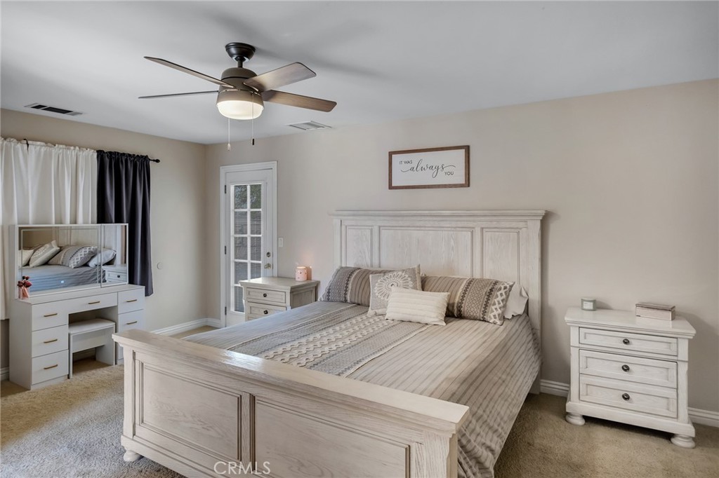 14952 Rivers Edge Road Helendale, CA 92342 - Photo 24 of 33 a bedroom with a bed and a dresser