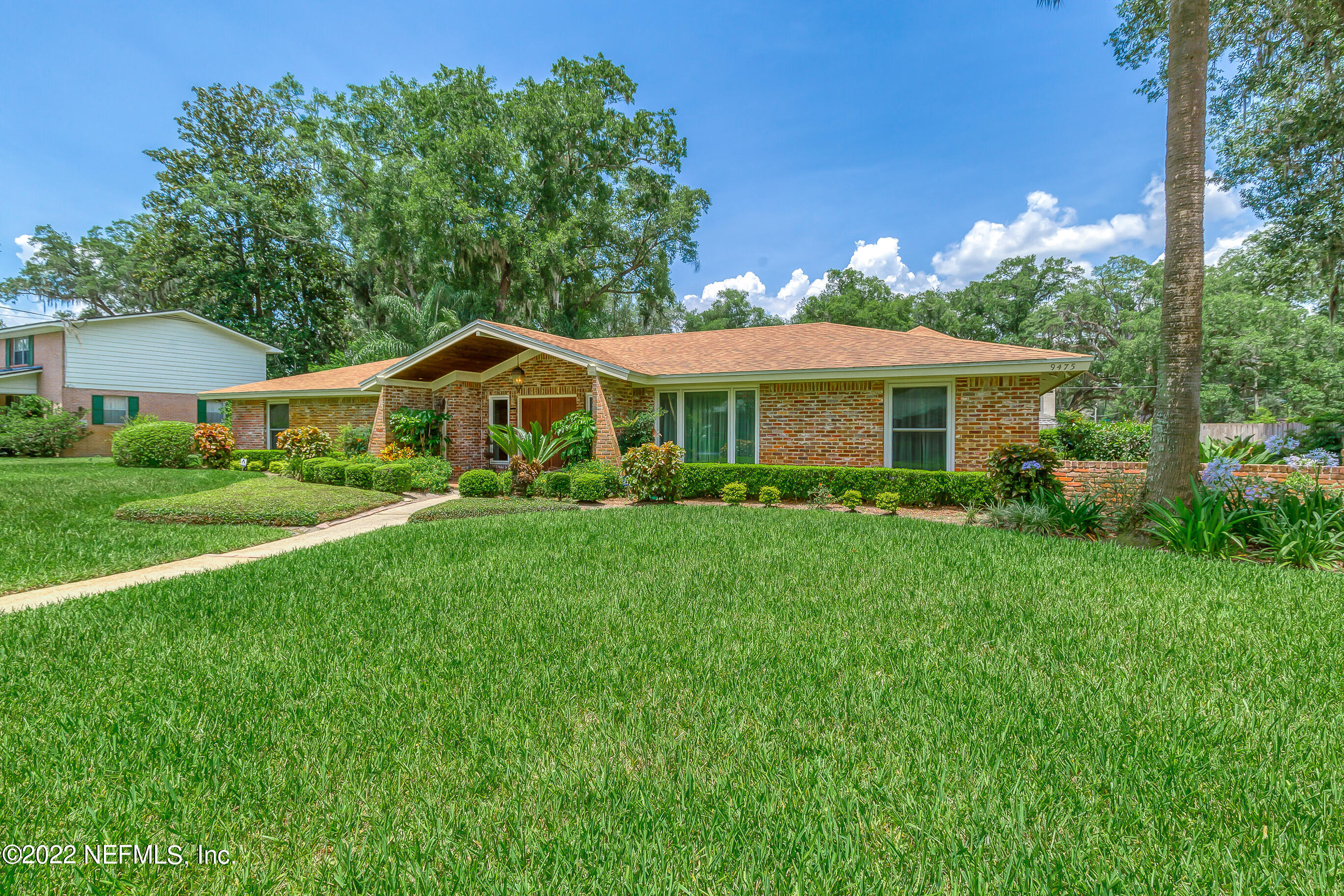 9475 Woodhaven Road Jacksonville, FL 32257 - Photo 61 of 78 a front view of a house with a yard