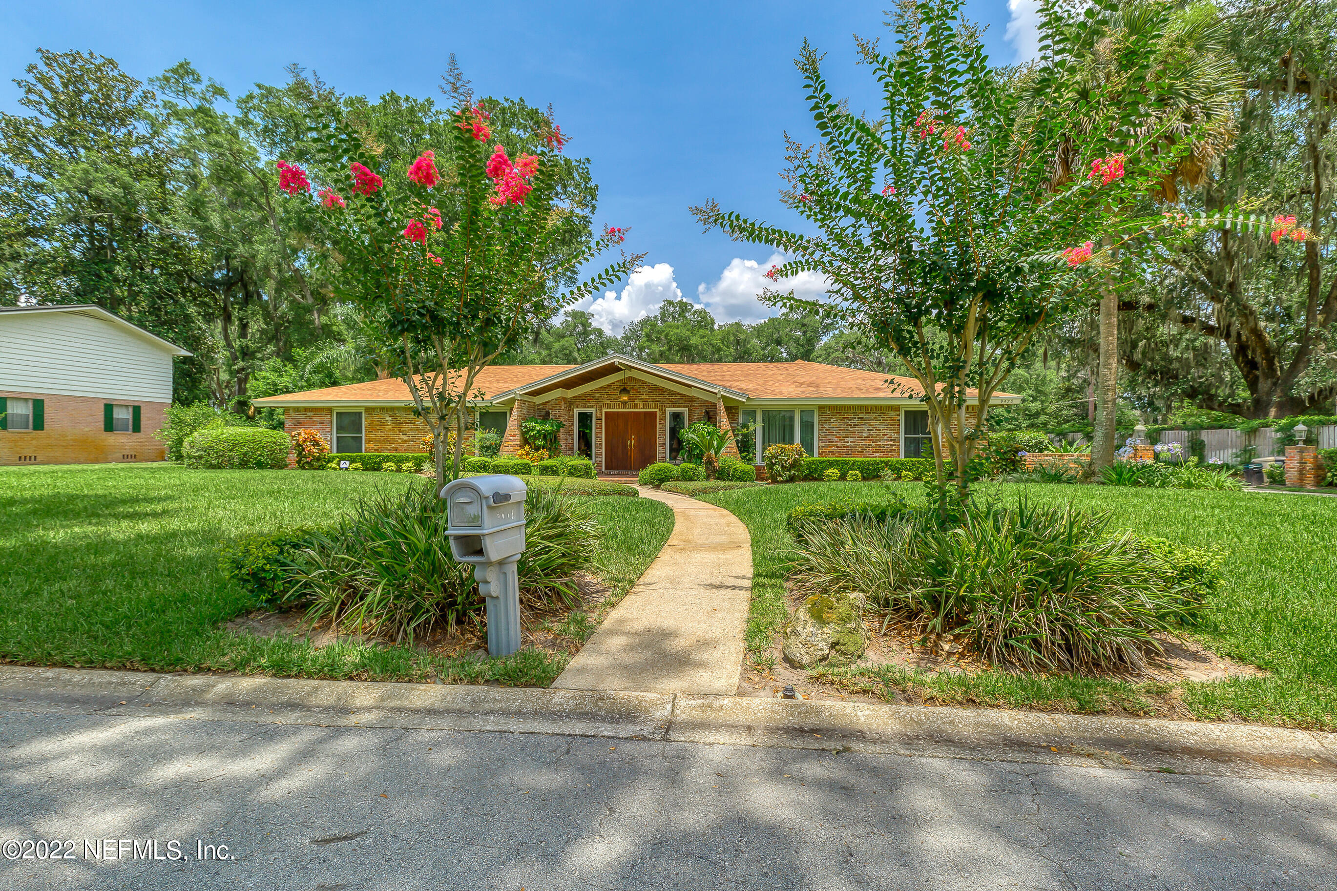 9475 Woodhaven Road Jacksonville, FL 32257 - Photo 62 of 78 a front view of a house with a yard