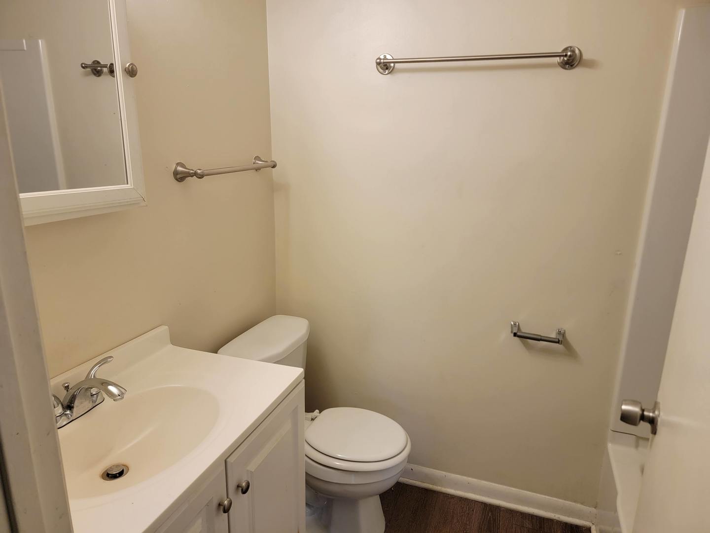 117 South Willow Lane Glenwood, IL 60425 - Photo 22 of 27 a white toilet sitting next to a bathroom sink