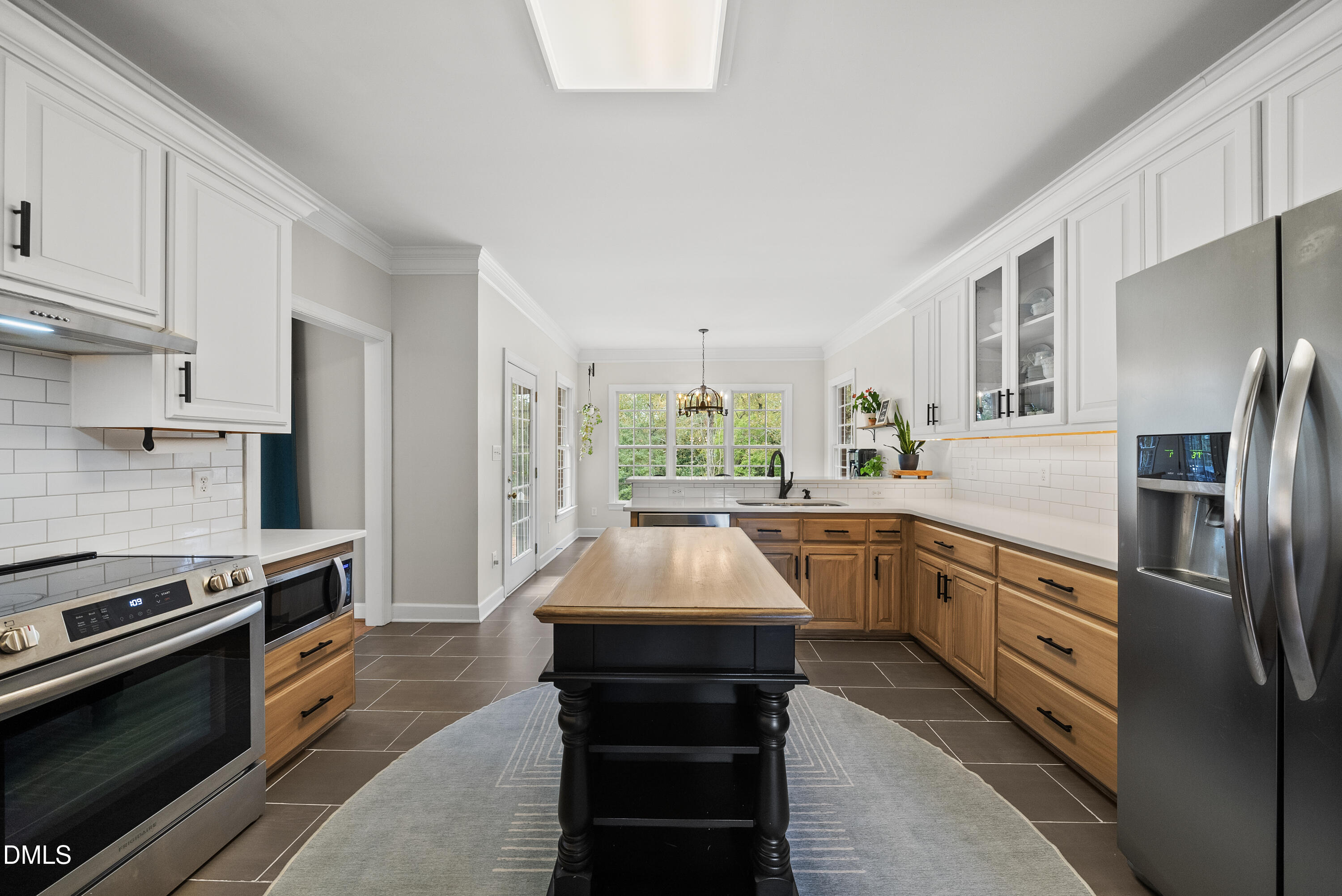 72 Clover Ridge Angier, NC 27501 - Photo 11 of 47 a kitchen with stainless steel appliances granite countertop a stove and a refrigerator