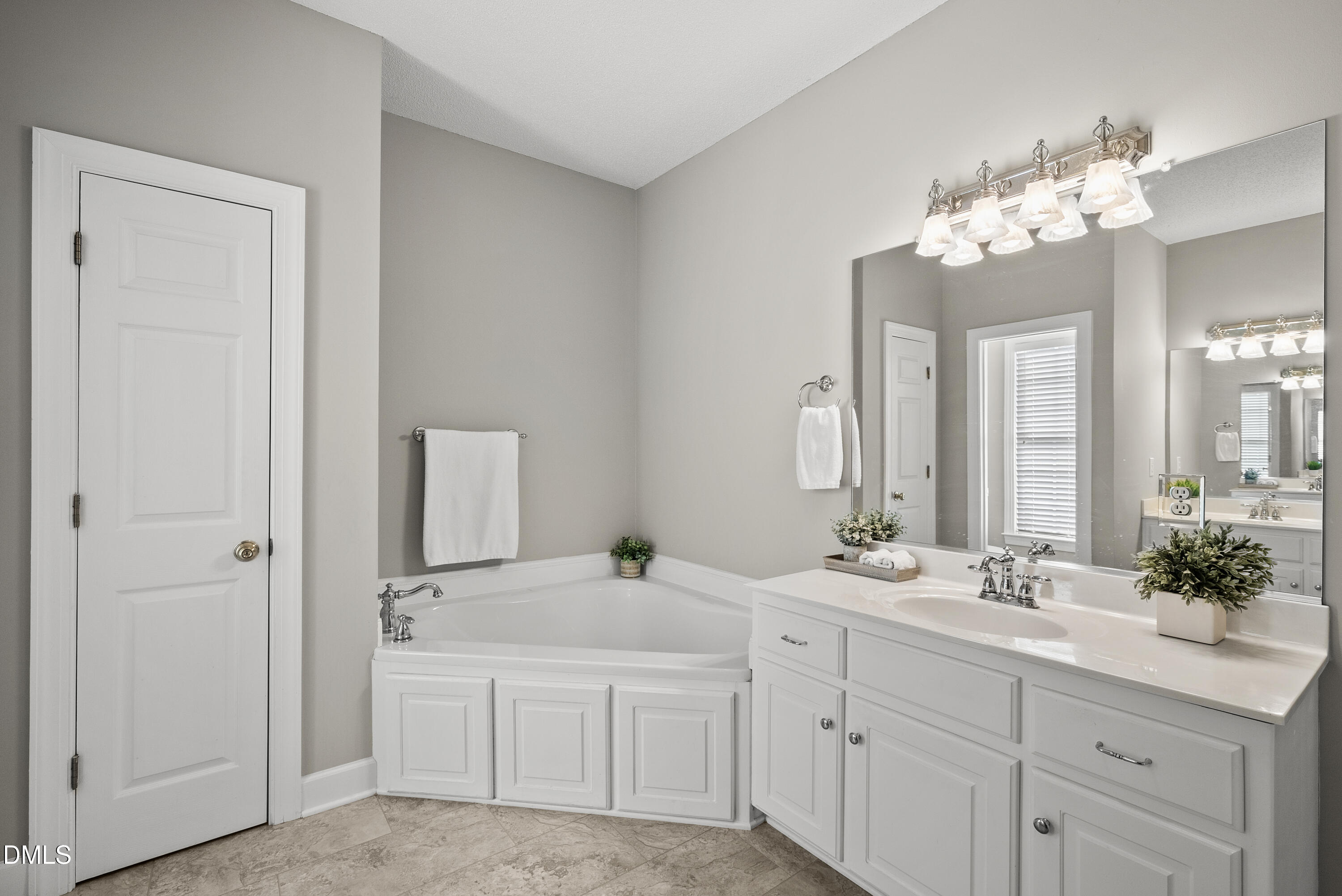 72 Clover Ridge Angier, NC 27501 - Photo 20 of 47 a bathroom with a double vanity sink and a mirror