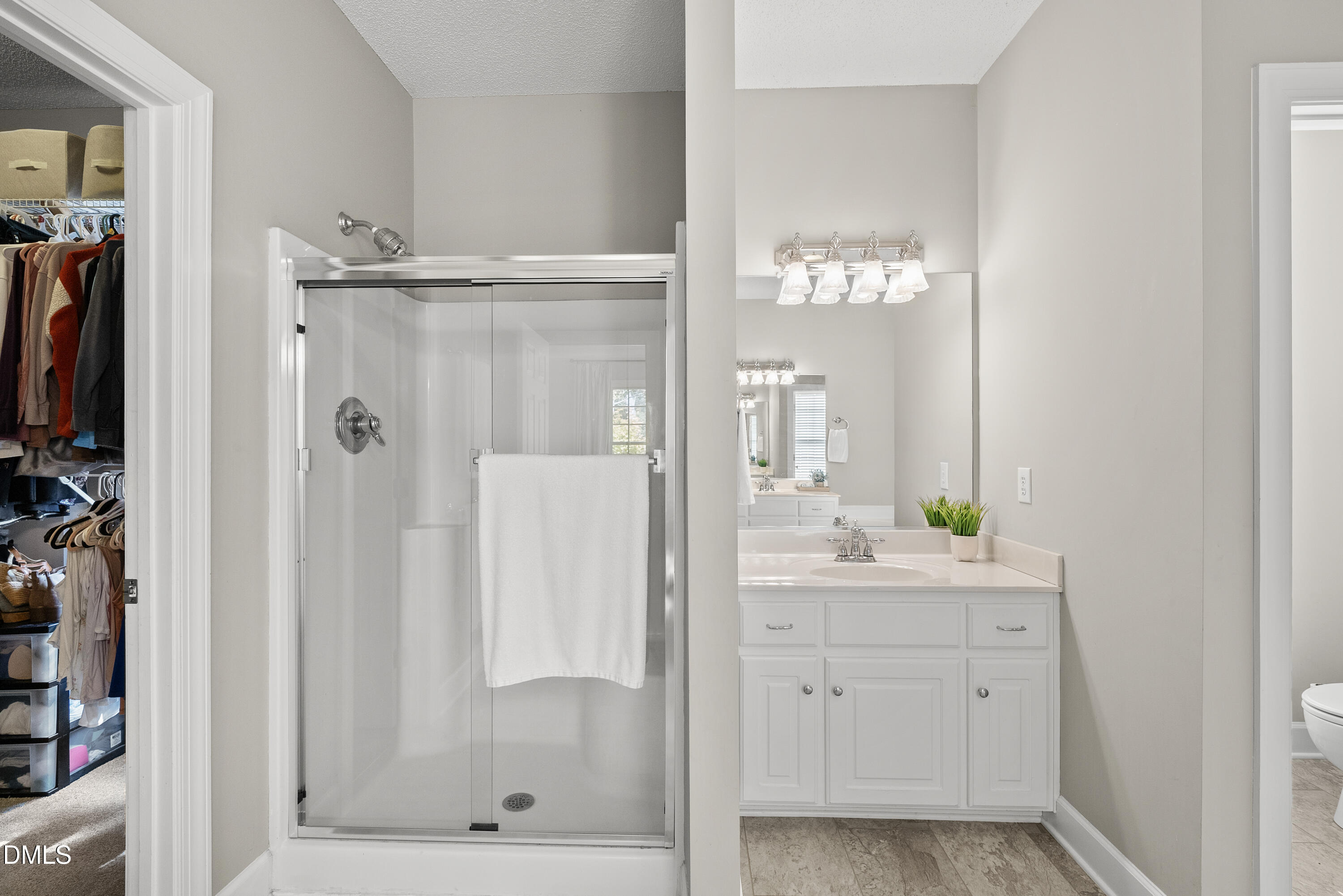 72 Clover Ridge Angier, NC 27501 - Photo 21 of 47 a bathroom with a shower a mirror and a sink