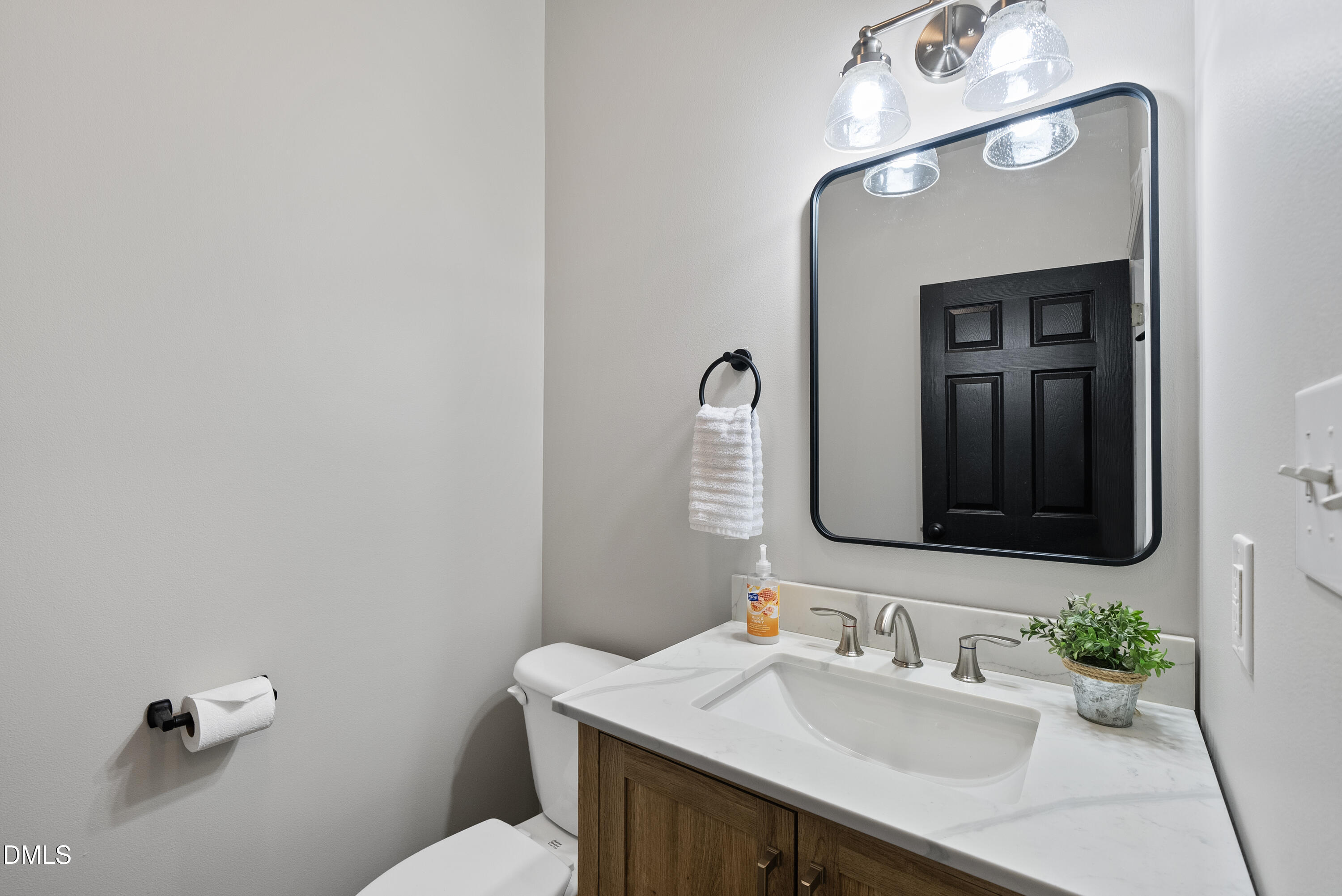72 Clover Ridge Angier, NC 27501 - Photo 28 of 47 a bathroom with a sink vanity and a mirror
