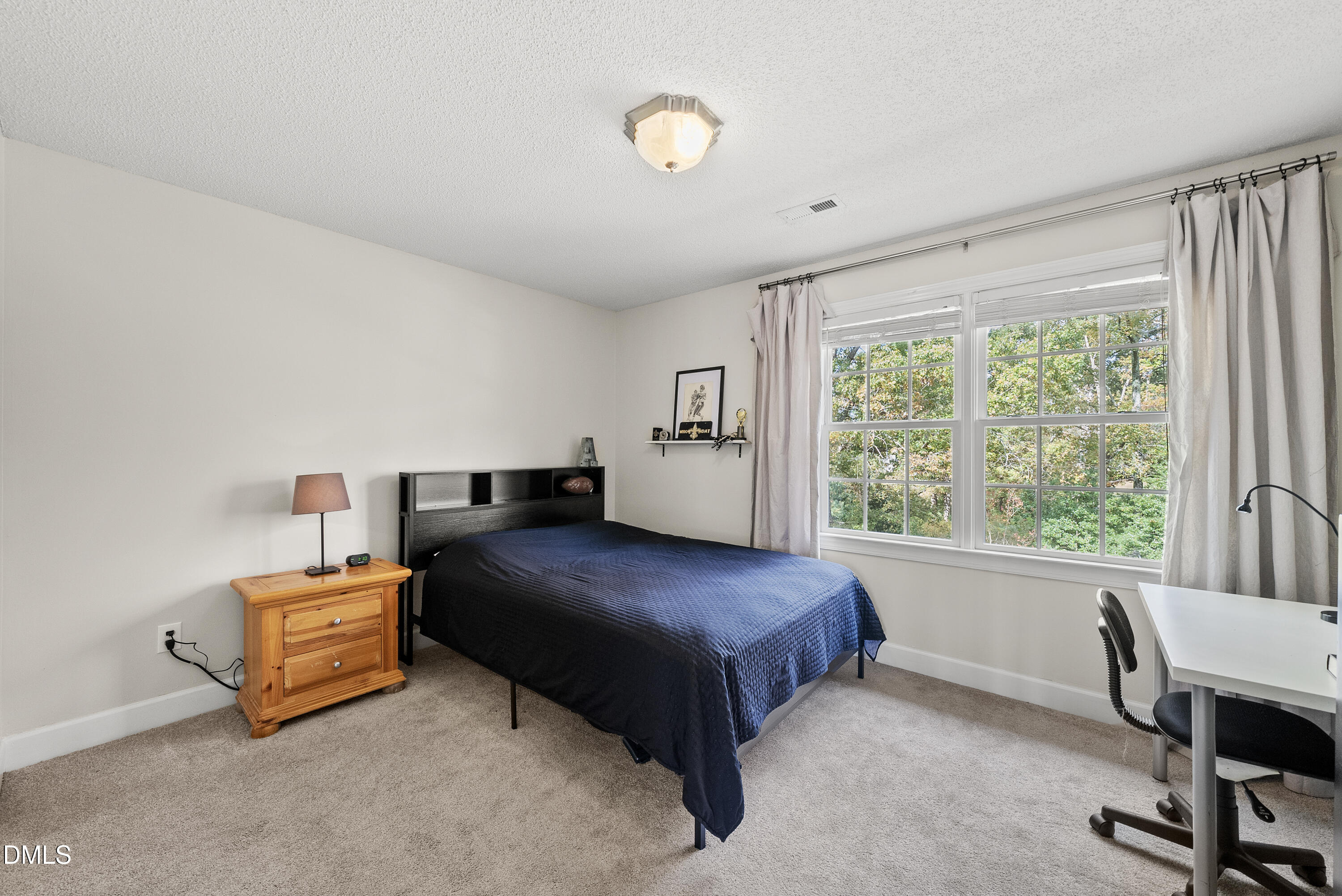 72 Clover Ridge Angier, NC 27501 - Photo 31 of 47 a bedroom with a bed and a desk