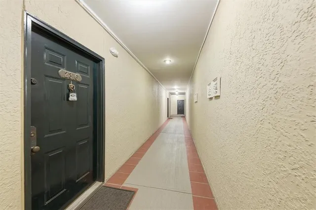 a hallway with wooden floor