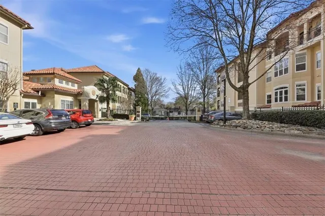 a city street lined with buildings and cars